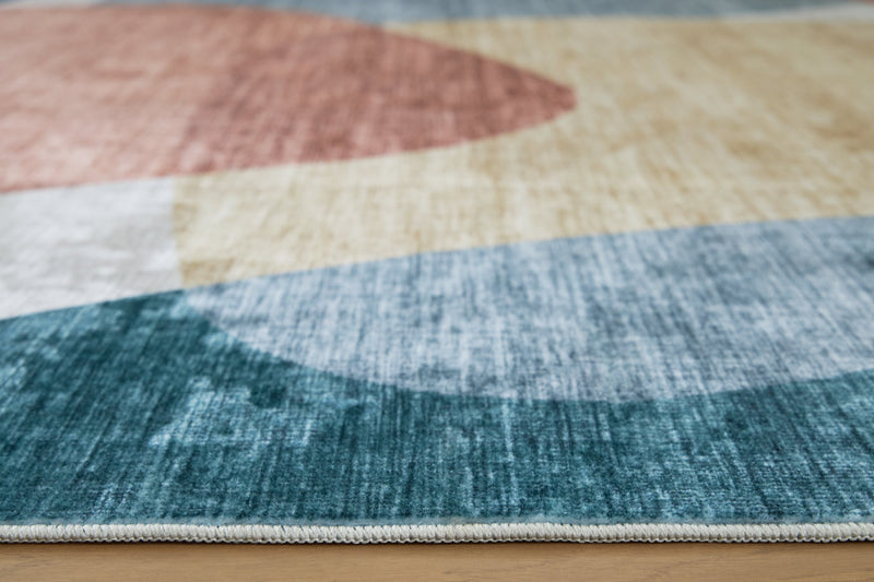 Chanleigh Washable 5' x 7' Area Rug - Ace Furniture and Decor
