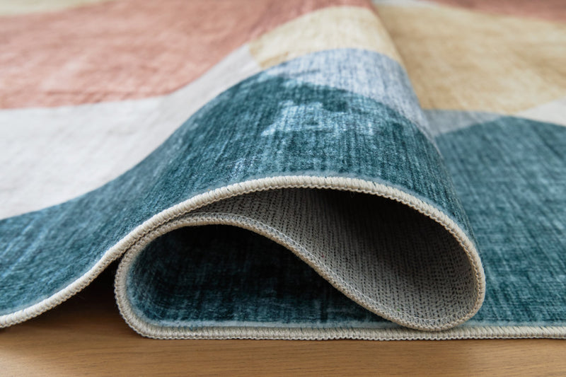 Chanleigh Washable 5' x 7' Area Rug - Ace Furniture and Decor