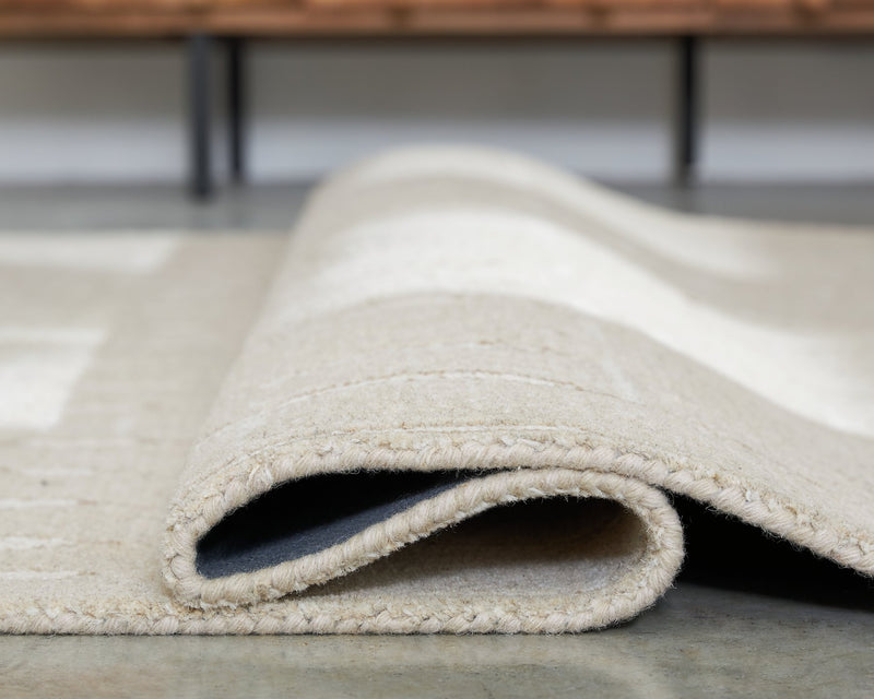 Wolbert 7'8" x 10' Area Rug - Ace Furniture and Decor